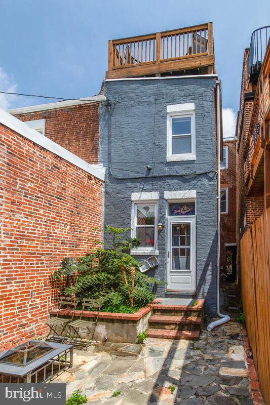743 W Cross St, Baltimore, MD 21230 - rear view of property featuring brick siding