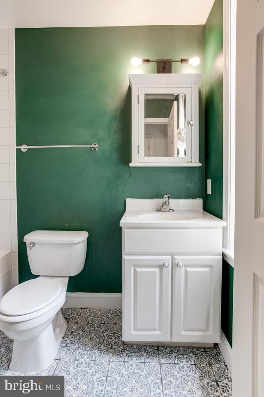743 W Cross St, Baltimore, MD 21230 - bathroom featuring vanity and tile patterned flooring