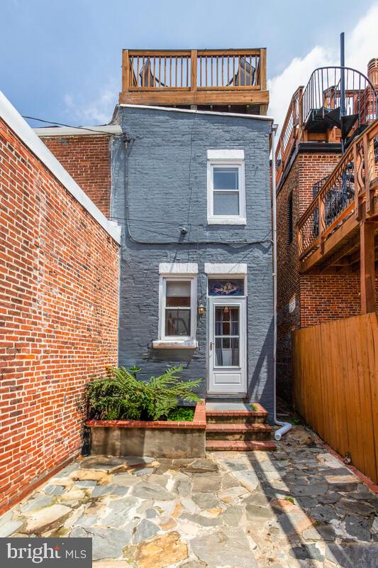 743 W Cross St, Baltimore, MD 21230 - rear view of house with brick siding