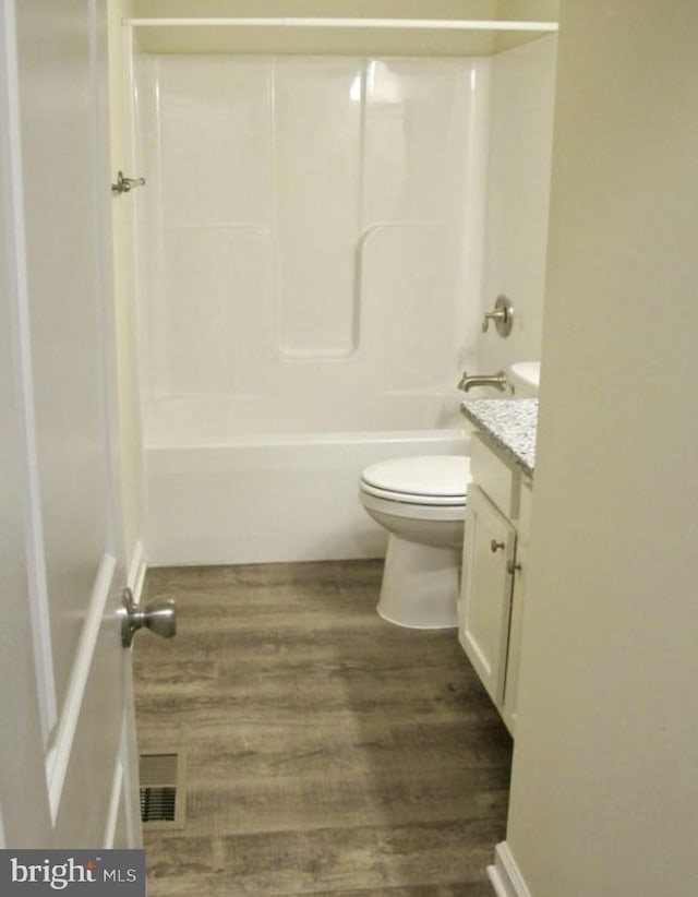 520 Glebe Rd S, Montross, VA 22520 - full bathroom with vanity, toilet, wood finished floors, and shower / tub combination