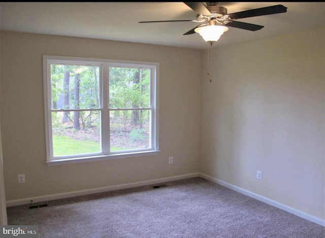 520 Glebe Rd S, Montross, VA 22520 - carpeted spare room with baseboards and a ceiling fan