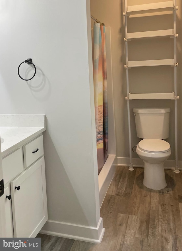 520 Glebe Rd S, Montross, VA 22520 - full bath featuring vanity, wood finished floors, toilet, and a shower with curtain