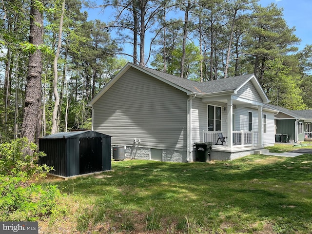 520 Glebe Rd S, Montross, VA 22520 - view of side of home with a porch, a yard, central AC, and a shingled roof