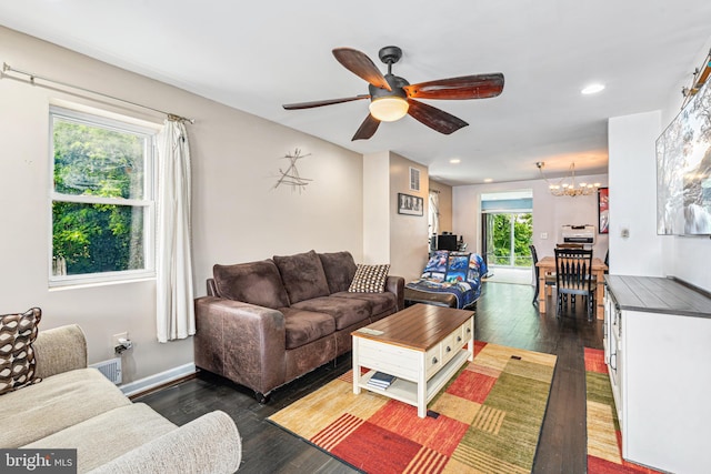 656 48th St, Baltimore, MD 21224 - living room featuring a chandelier, ceiling fan, dark wood-style flooring, and recessed lighting