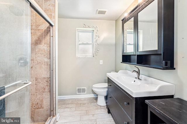 656 48th St, Baltimore, MD 21224 - full bath featuring vanity, toilet, a stall shower, and baseboards