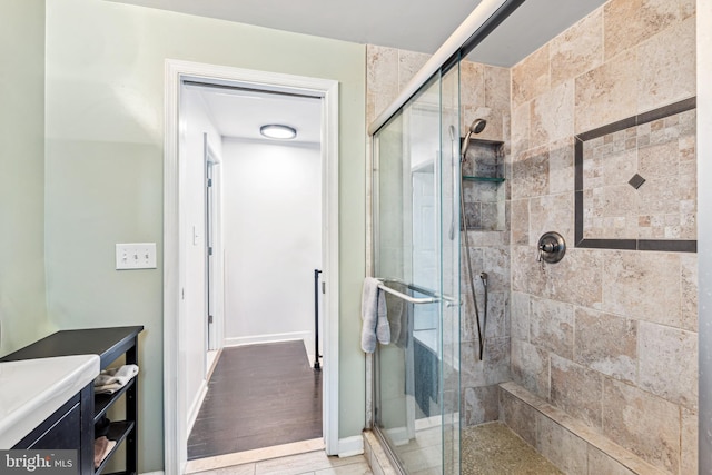 656 48th St, Baltimore, MD 21224 - bathroom featuring a stall shower and baseboards