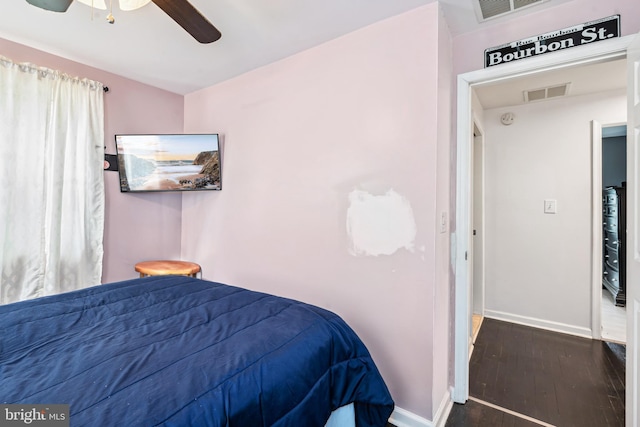 656 48th St, Baltimore, MD 21224 - bedroom featuring baseboards, wood finished floors, and ceiling fan