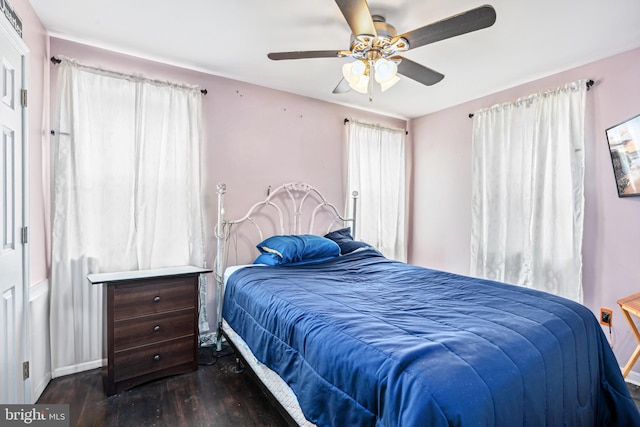 656 48th St, Baltimore, MD 21224 - bedroom featuring wood finished floors, a ceiling fan, and baseboards