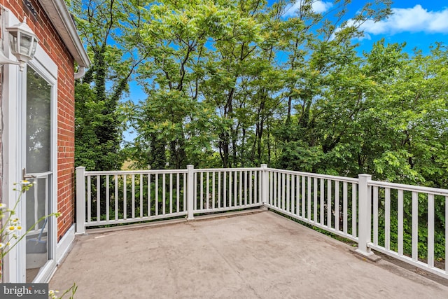 656 48th St, Baltimore, MD 21224 - view of patio / terrace with view of wooded area