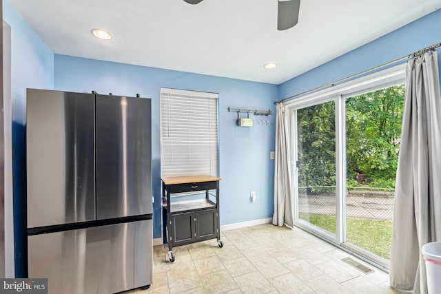 656 48th St, Baltimore, MD 21224 - kitchen featuring freestanding refrigerator, a ceiling fan, and baseboards