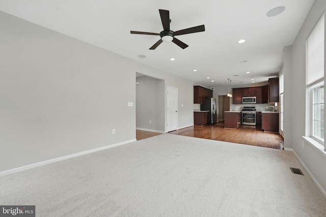 11 Worsham Ln, Fredericksburg, VA 22405 - unfurnished living room with dark carpet, baseboards, a ceiling fan, recessed lighting, and dark wood finished floors