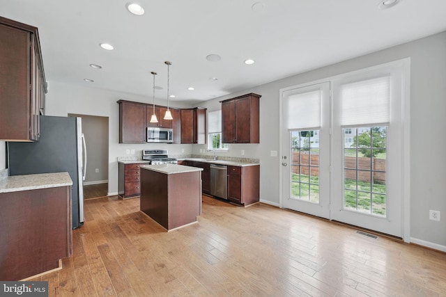 11 Worsham Ln, Fredericksburg, VA 22405 - kitchen with stainless steel appliances, a kitchen island, recessed lighting, baseboards, and dark brown cabinetry