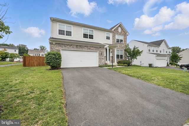 11 Worsham Ln, Fredericksburg, VA 22405 - view of front facade featuring stone siding, a garage, and driveway