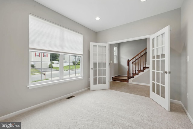 11 Worsham Ln, Fredericksburg, VA 22405 - spare room featuring french doors, carpet, baseboards, stairway, and recessed lighting