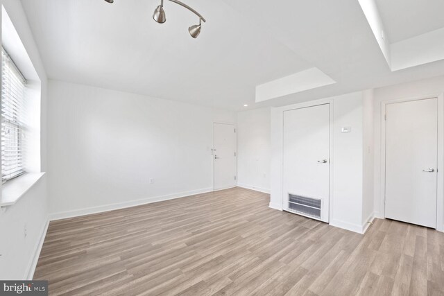 2900 Pomeroy Rd SE Unit 203, Washington, DC 20020 - unfurnished living room featuring light wood-style flooring and baseboards