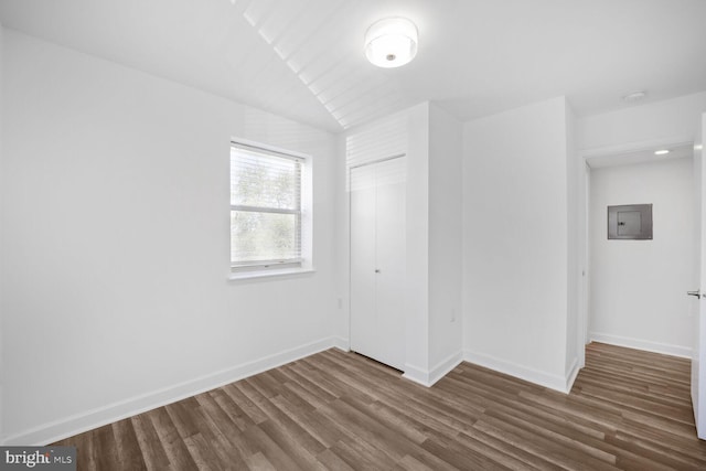 2900 Pomeroy Rd SE Unit 203, Washington, DC 20020 - unfurnished bedroom featuring a closet, wood finished floors, electric panel, and baseboards