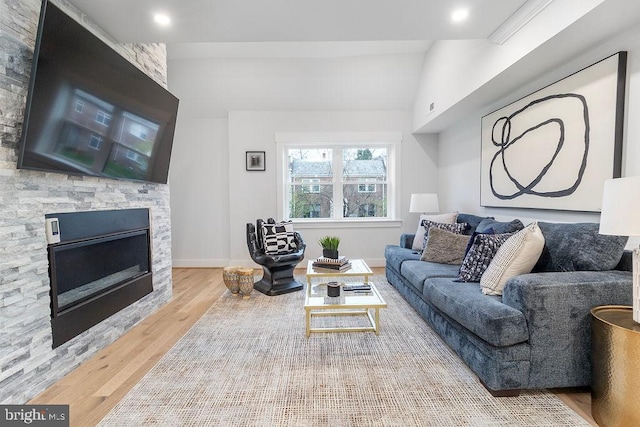 1242 Meigs Pl NE Unit C, Washington, DC 20002 - living room with wood finished floors, a fireplace, lofted ceiling, and baseboards