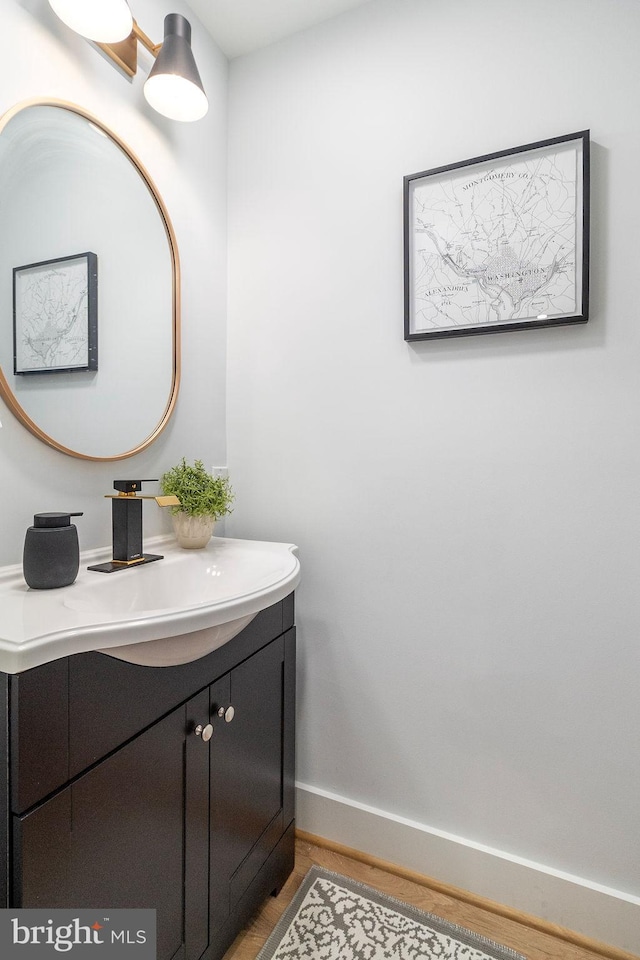 1242 Meigs Pl NE Unit C, Washington, DC 20002 - bathroom with vanity, baseboards, and wood finished floors