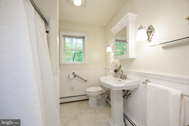 337 Greene Rd, Berwyn, PA 19312 - full bathroom with a baseboard radiator, a wainscoted wall, toilet, and curtained shower