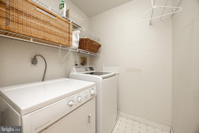 337 Greene Rd, Berwyn, PA 19312 - washroom with washer and dryer, baseboards, and light flooring