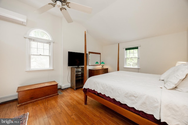 337 Greene Rd, Berwyn, PA 19312 - bedroom with multiple windows, lofted ceiling, wood finished floors, and a baseboard radiator