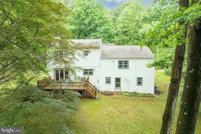 337 Greene Rd, Berwyn, PA 19312 - back of property featuring a deck, a lawn, stucco siding, and stairway