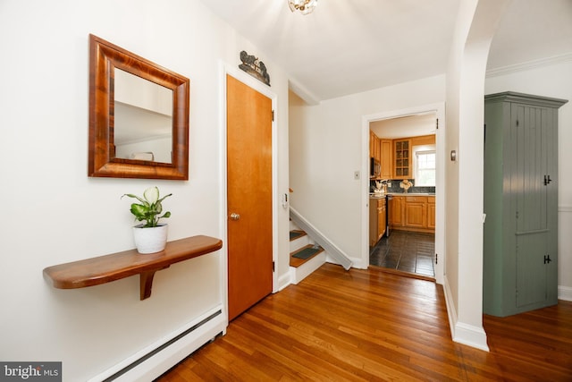 337 Greene Rd, Berwyn, PA 19312 - hallway with dark wood finished floors, stairway, baseboards, and baseboard heating