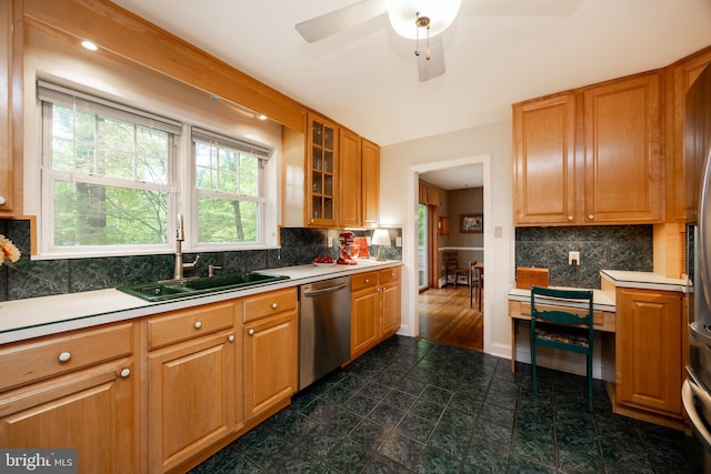337 Greene Rd, Berwyn, PA 19312 - kitchen featuring dishwasher, a sink, light countertops, and decorative backsplash