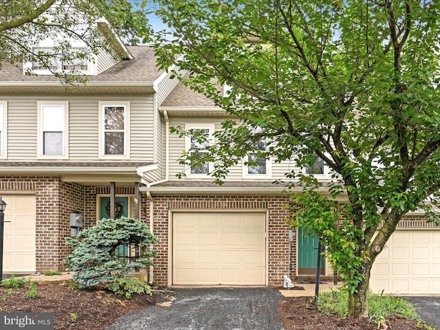 49 Westpointe Dr, Ephrata, PA 17522 - view of front of property featuring roof with shingles, brick siding, asphalt driveway, and a garage