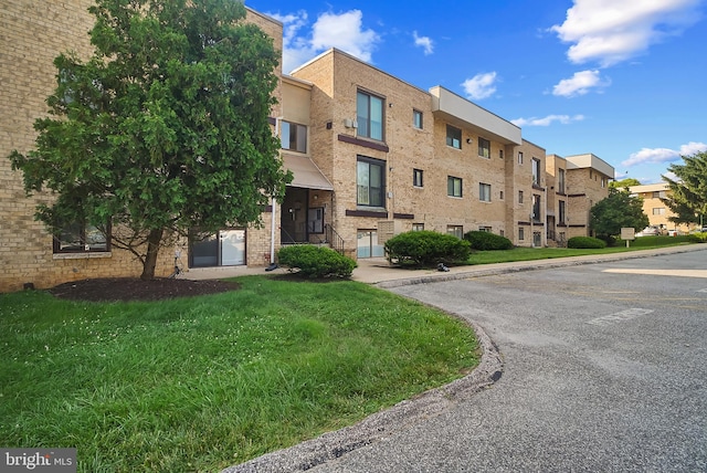 3922 Rolling Rd Unit A8, Pikesville, MD 21208 - view of building exterior featuring uncovered parking and a residential view