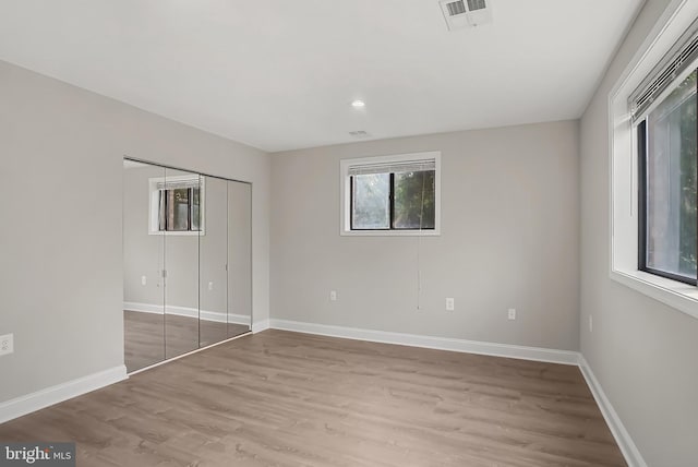 3922 Rolling Rd Unit A8, Pikesville, MD 21208 - unfurnished bedroom with light wood-type flooring, a closet, and recessed lighting