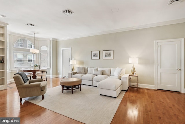 1830 S Rittenhouse Square 12C And 12D, Philadelphia, PA 19103 - living room featuring hardwood / wood-style floors, crown molding, and baseboards