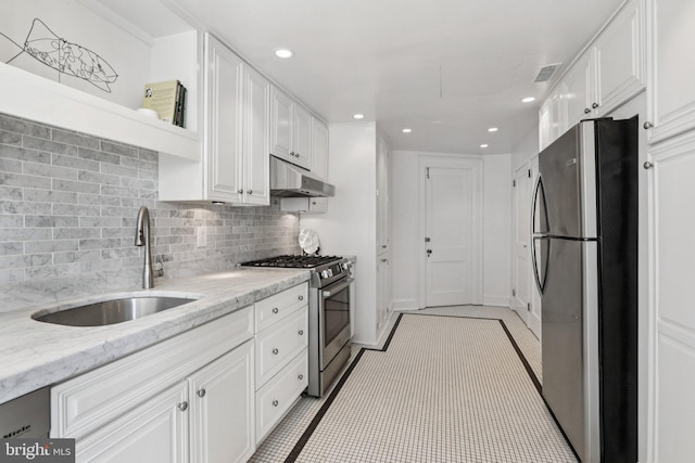 1830 S Rittenhouse Square 12C And 12D, Philadelphia, PA 19103 - kitchen with stainless steel appliances, under cabinet range hood, a sink, white cabinetry, and open shelves