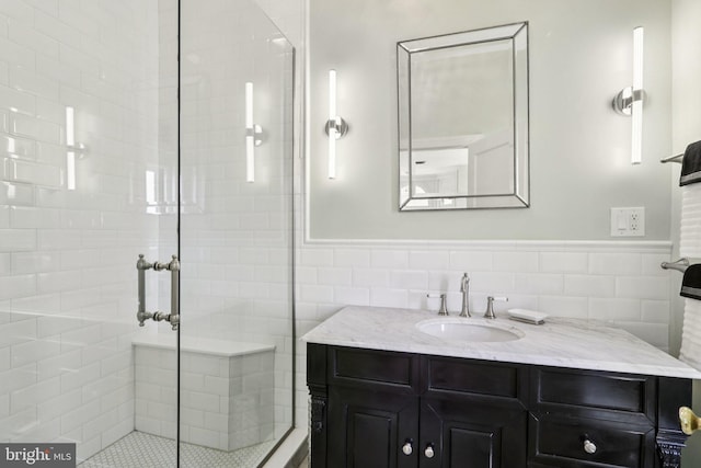 1830 S Rittenhouse Square 12C And 12D, Philadelphia, PA 19103 - full bath featuring tile walls, vanity, a shower stall, and a wainscoted wall