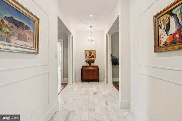 1830 S Rittenhouse Square 12C And 12D, Philadelphia, PA 19103 - hall with ornate columns, a chandelier, baseboards, and recessed lighting