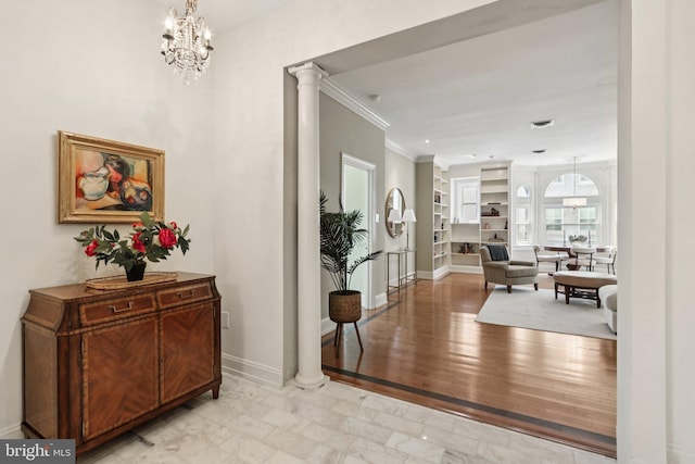 1830 S Rittenhouse Square 12C And 12D, Philadelphia, PA 19103 - corridor featuring crown molding, decorative columns, baseboards, built in shelves, and a chandelier