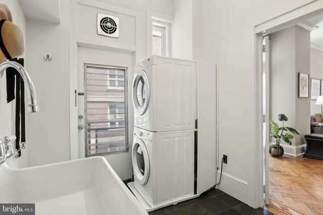 1830 S Rittenhouse Square 12C And 12D, Philadelphia, PA 19103 - laundry area featuring stacked washer / drying machine and baseboards