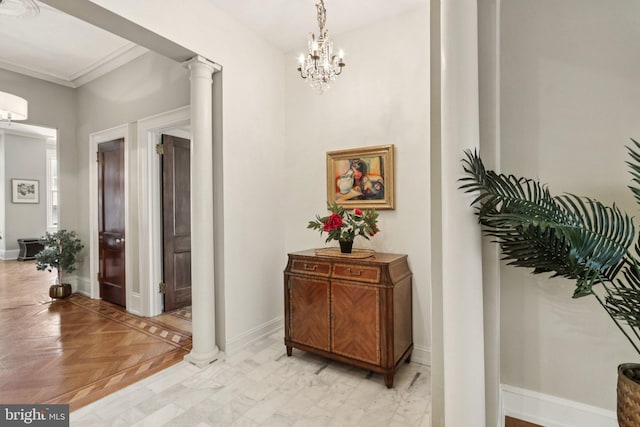 1830 S Rittenhouse Square 12C And 12D, Philadelphia, PA 19103 - hall with ornate columns, a chandelier, baseboards, and crown molding