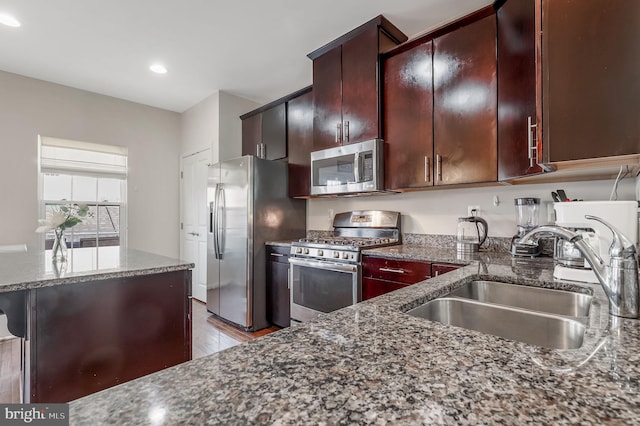 2620 Egret Way, Frederick, MD 21701 - kitchen featuring stainless steel appliances, a sink, dark stone countertops, recessed lighting, and wood finished floors