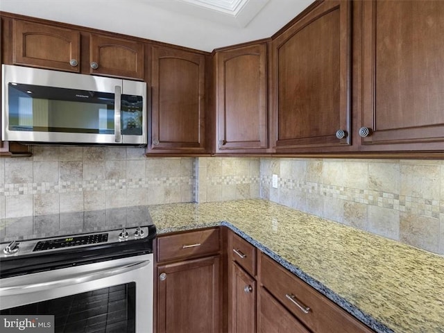2956 Hathaway Rd Unit 1205, Richmond, VA 23225 - kitchen featuring appliances with stainless steel finishes, light stone countertops, and backsplash