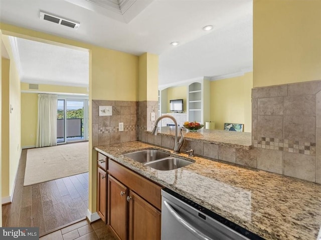 2956 Hathaway Rd Unit 1205, Richmond, VA 23225 - kitchen with a sink, light stone counters, brown cabinetry, dishwasher, and ornamental molding