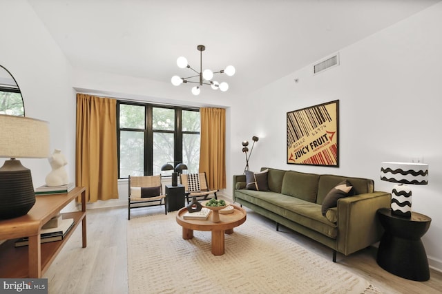 400 Massachusetts Ave NW Unit 223, Washington, DC 20001 - living area featuring light wood finished floors, a chandelier, and lofted ceiling