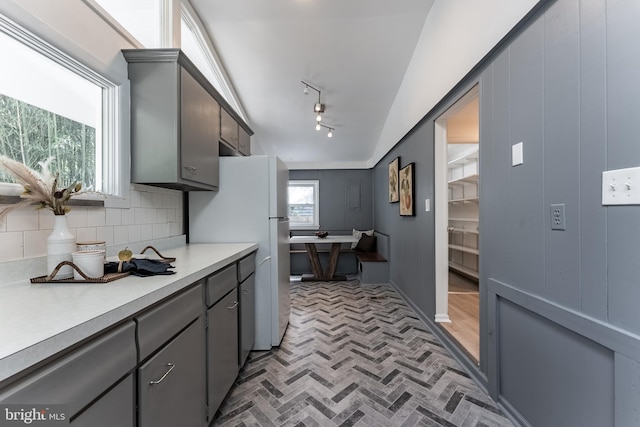 5634 8th Rd N, Arlington, VA 22205 - kitchen with gray cabinetry, freestanding refrigerator, light countertops, brick patterned floors, and tasteful backsplash