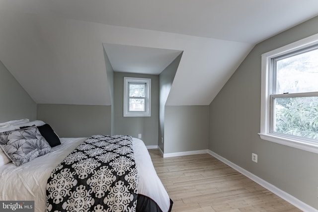 5634 8th Rd N, Arlington, VA 22205 - bedroom with lofted ceiling and wood finished floors