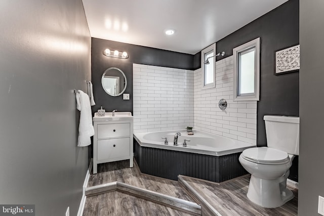 5634 8th Rd N, Arlington, VA 22205 - bathroom featuring a bathtub, wood finished floors, and vanity