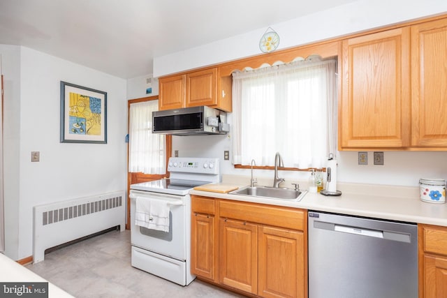 5307 Emory Rd, Upperco, MD 21155 - kitchen featuring radiator, appliances with stainless steel finishes, a sink, and light countertops