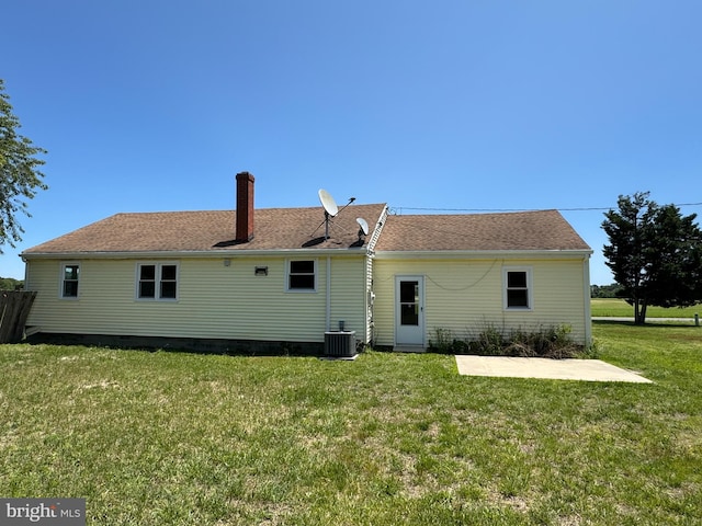 6016 Palmer Mill Rd, Hurlock, MD 21643 - back of property featuring a lawn, a chimney, and a patio