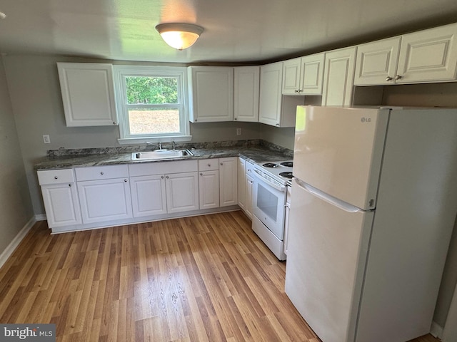 6016 Palmer Mill Rd, Hurlock, MD 21643 - kitchen with white appliances, white cabinets, light wood-style floors, and dark countertops