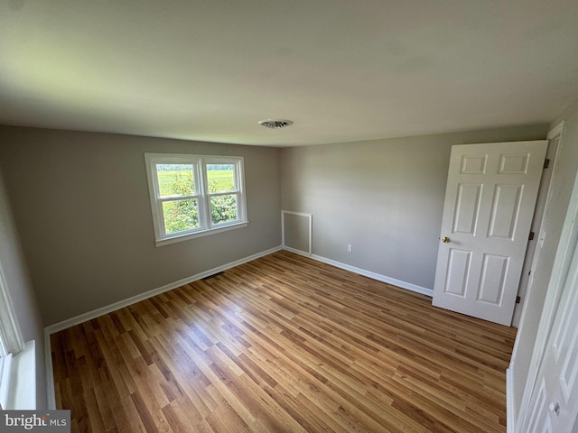 6016 Palmer Mill Rd, Hurlock, MD 21643 - spare room with wood finished floors and baseboards