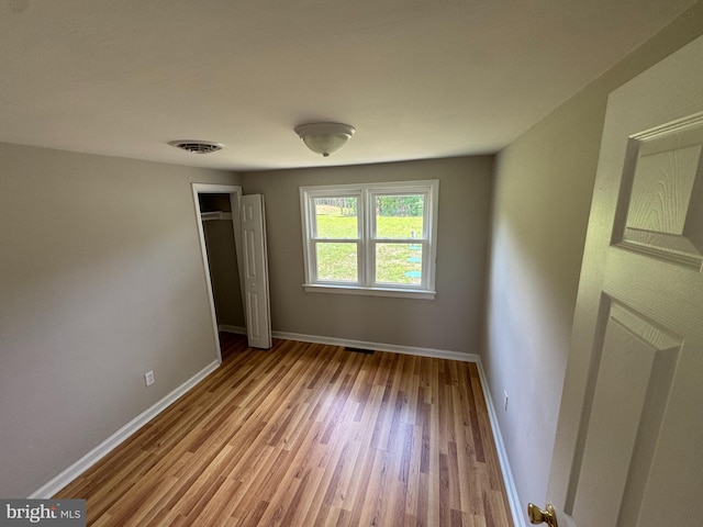 6016 Palmer Mill Rd, Hurlock, MD 21643 - unfurnished bedroom with light wood-type flooring and a closet